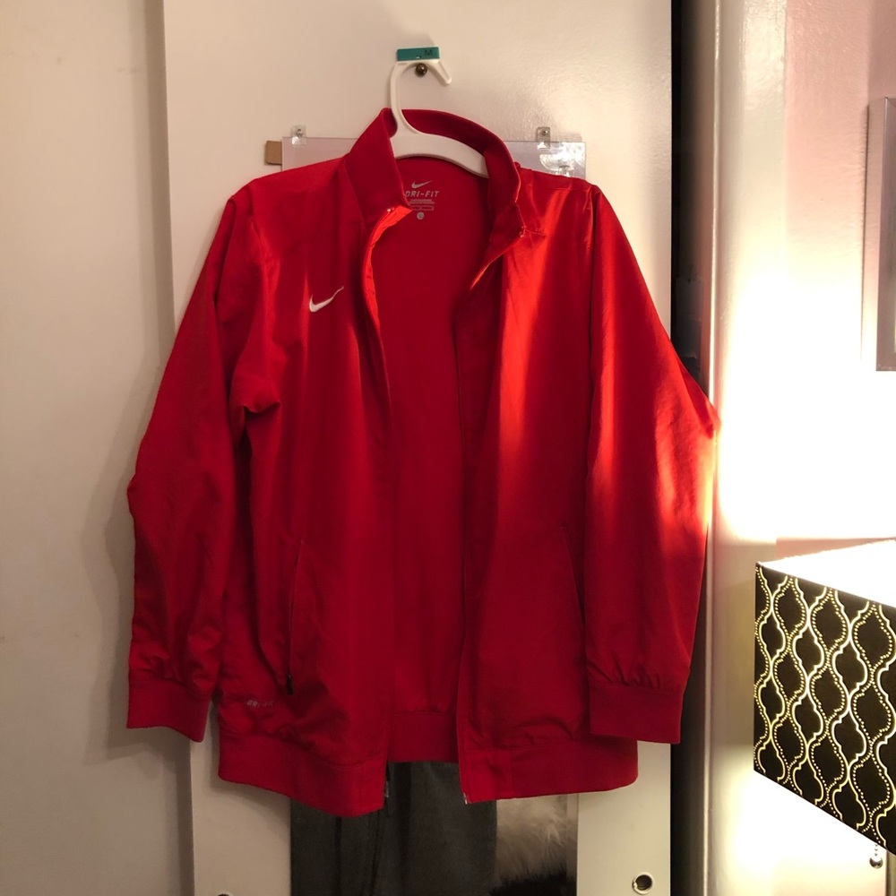 Red athletic dry fit Nike jacket